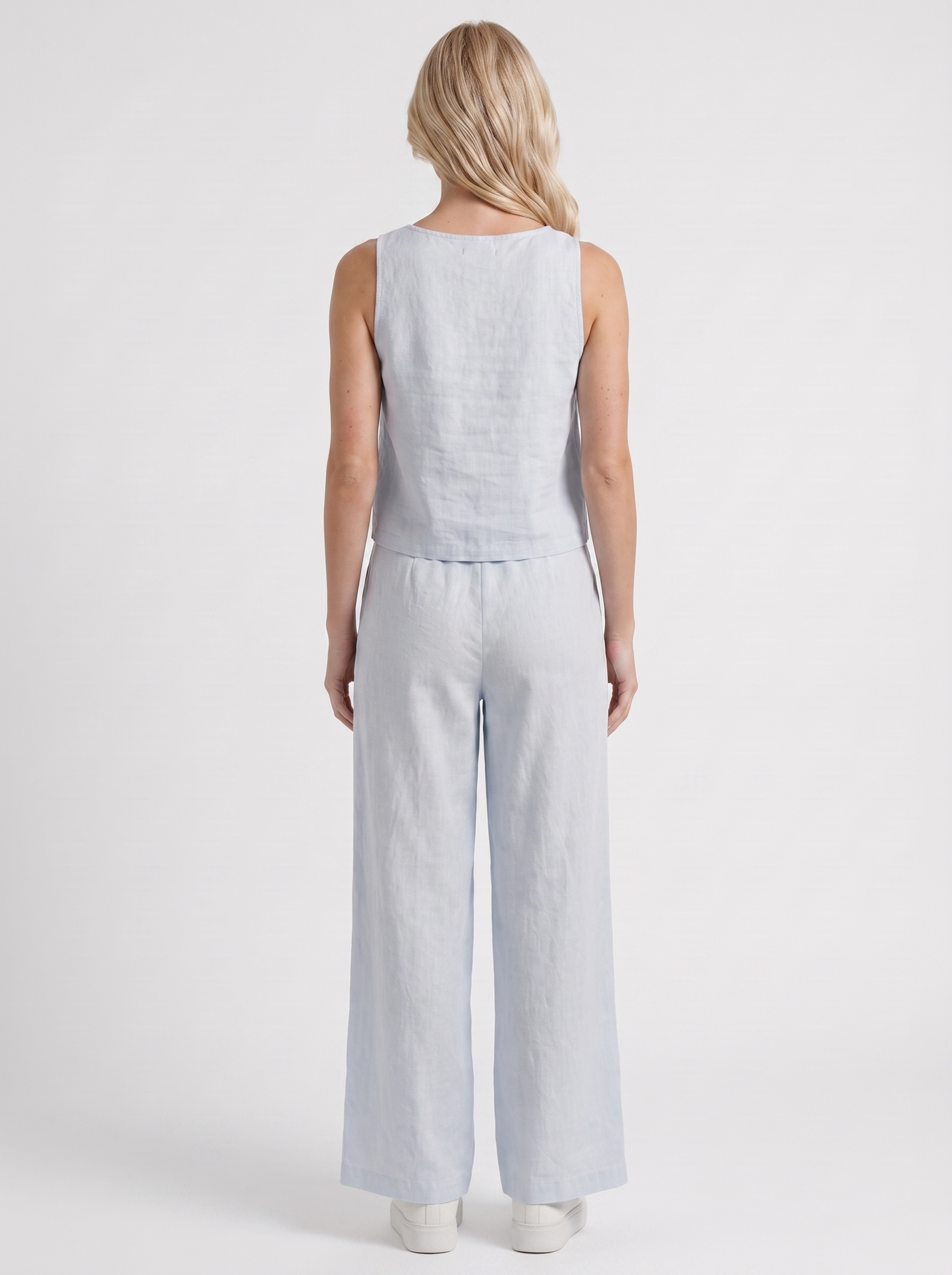Women white pants set with sleeveless linen top and round neckline
