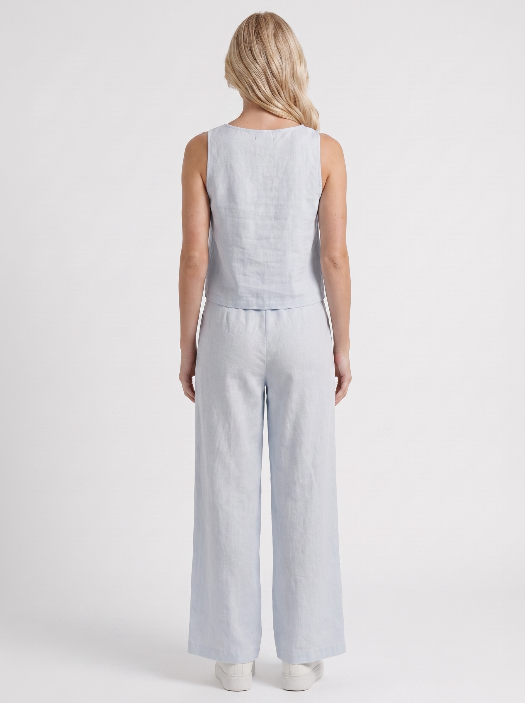 Women white pants set with sleeveless linen top and round neckline
