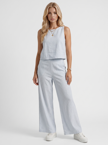 Women white pants set with sleeveless linen top and round neckline