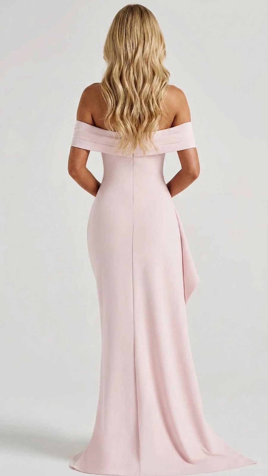Back view of women's pink ruched maxi dress, off-shoulder neckline, and smooth fitted structure