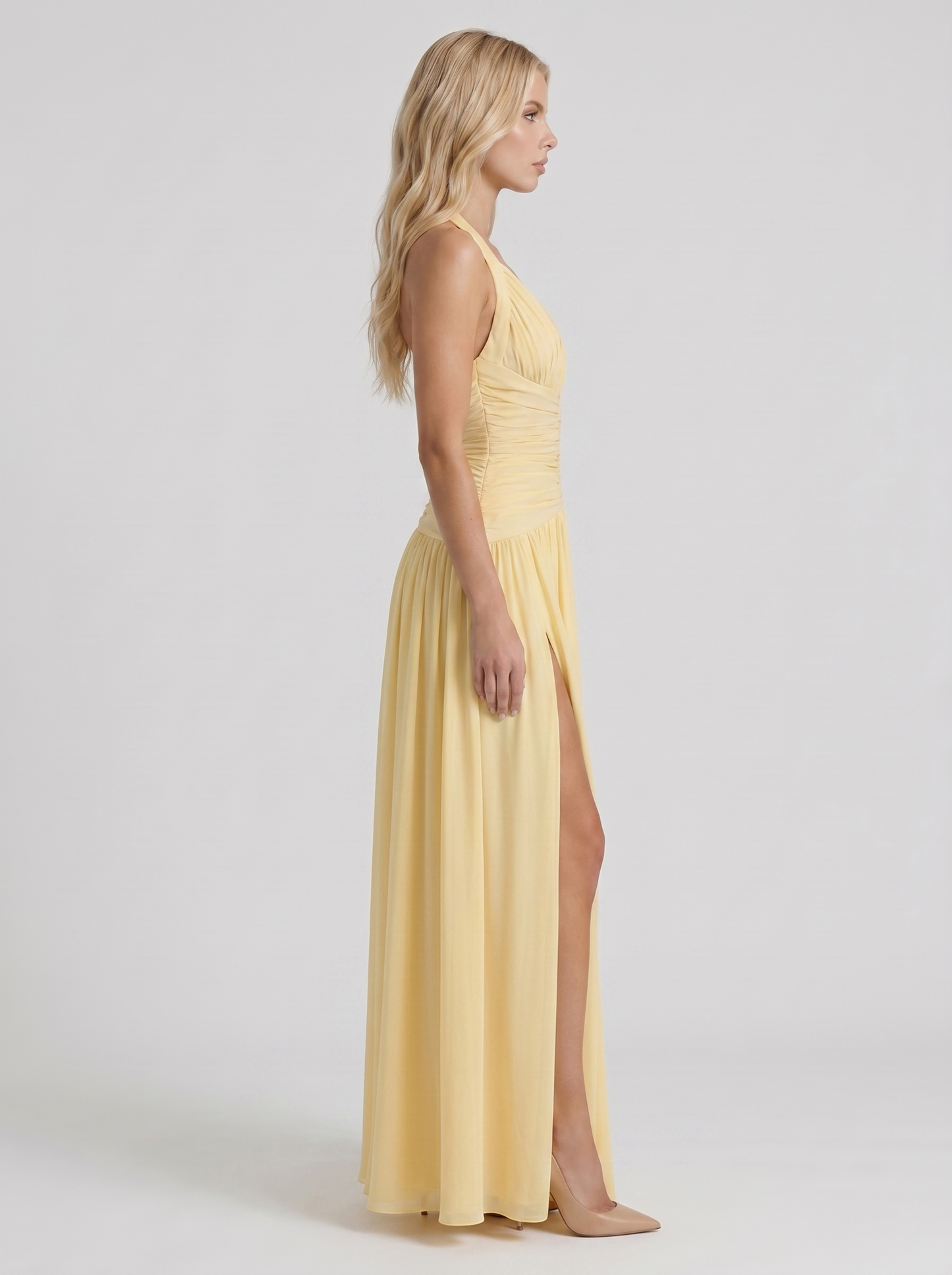 Women lemon halter ruched maxi dress with drop waist seam, side profile