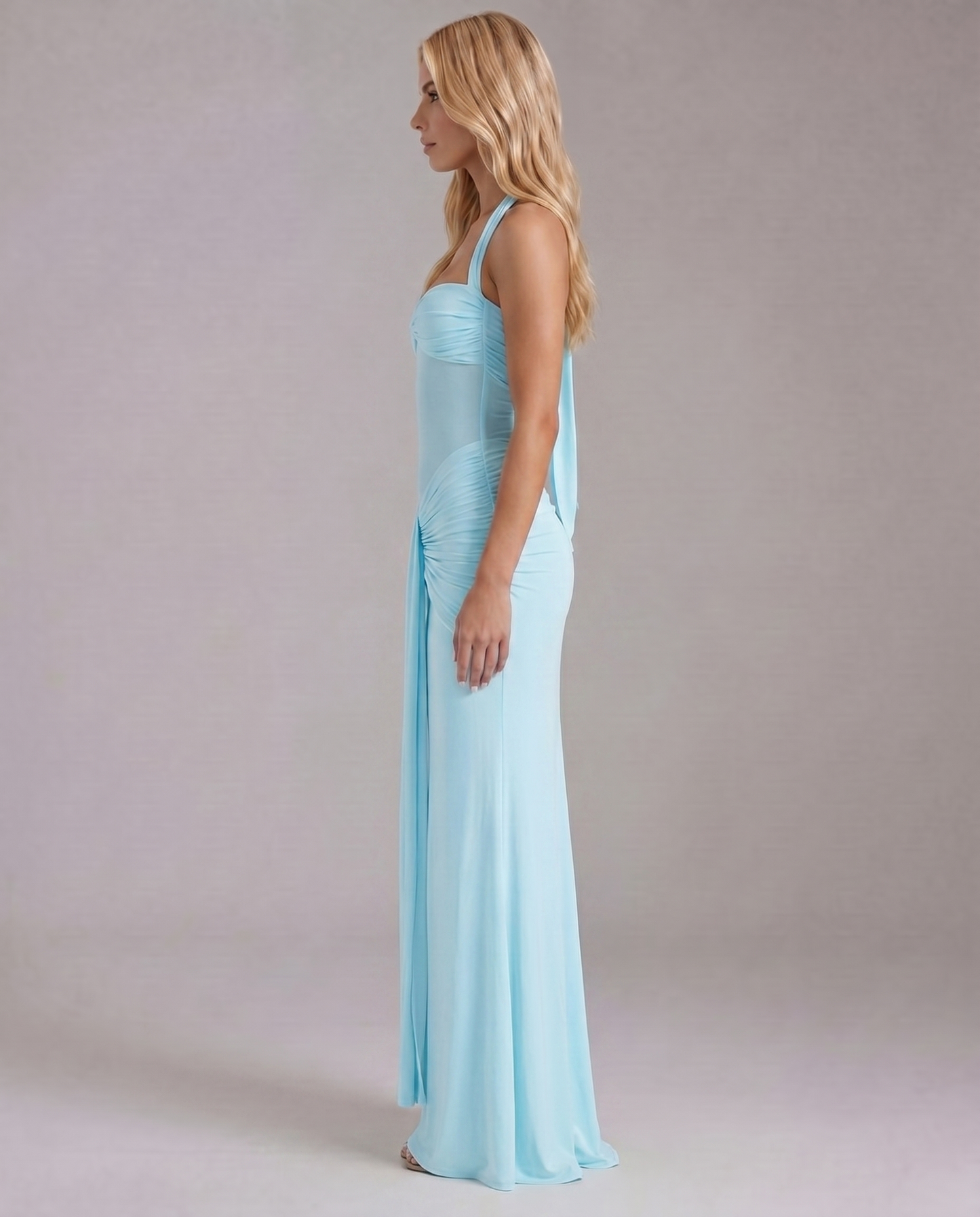 Women's light blue ruched bodycon dress with full-length skirt side profile