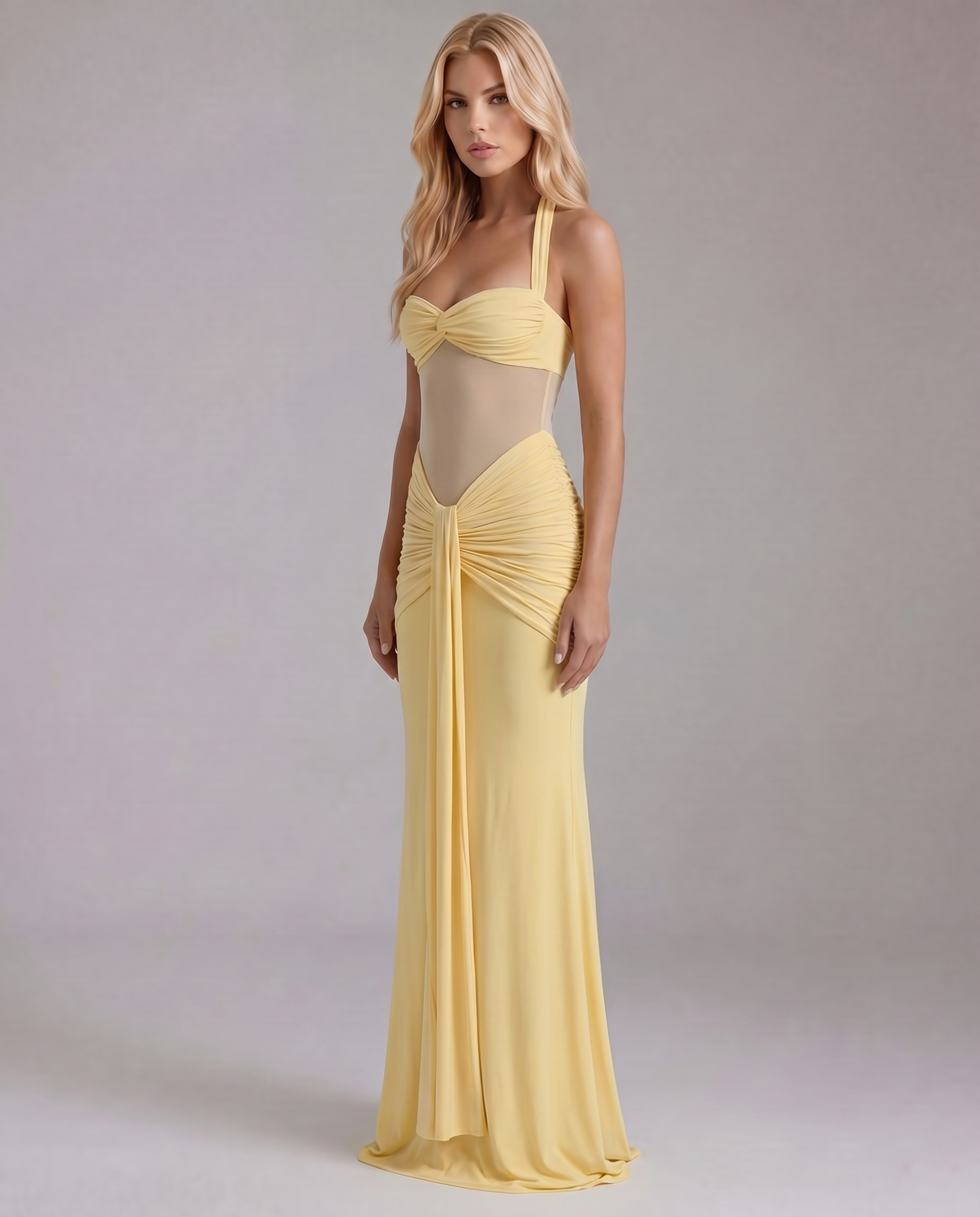 Women's yellow ruched maxi dress with draped waist detail, slightly angled front view.