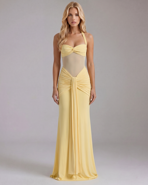 Women's yellow ruched maxi dress with halter neckline and sheer midriff, front view.