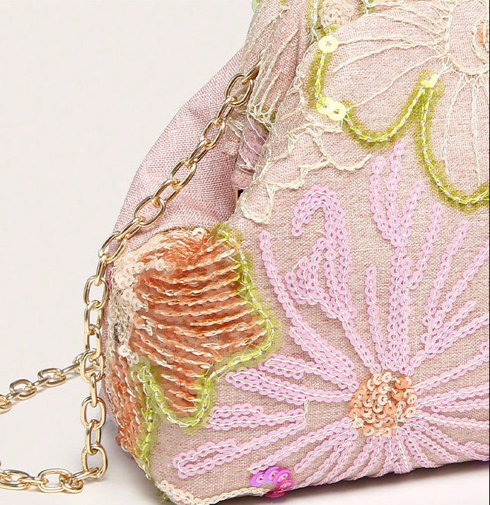 Women pink clutch bag with embroidered detail and sequin finish