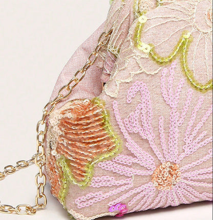 Women pink clutch bag with embroidered detail and sequin finish