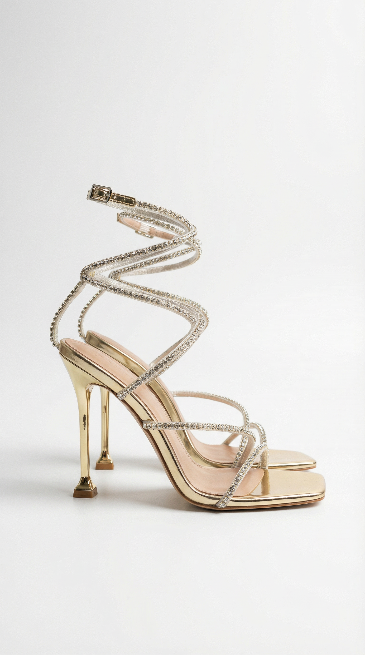 Women gold heeled sandals with wrap straps and rhinestone detail