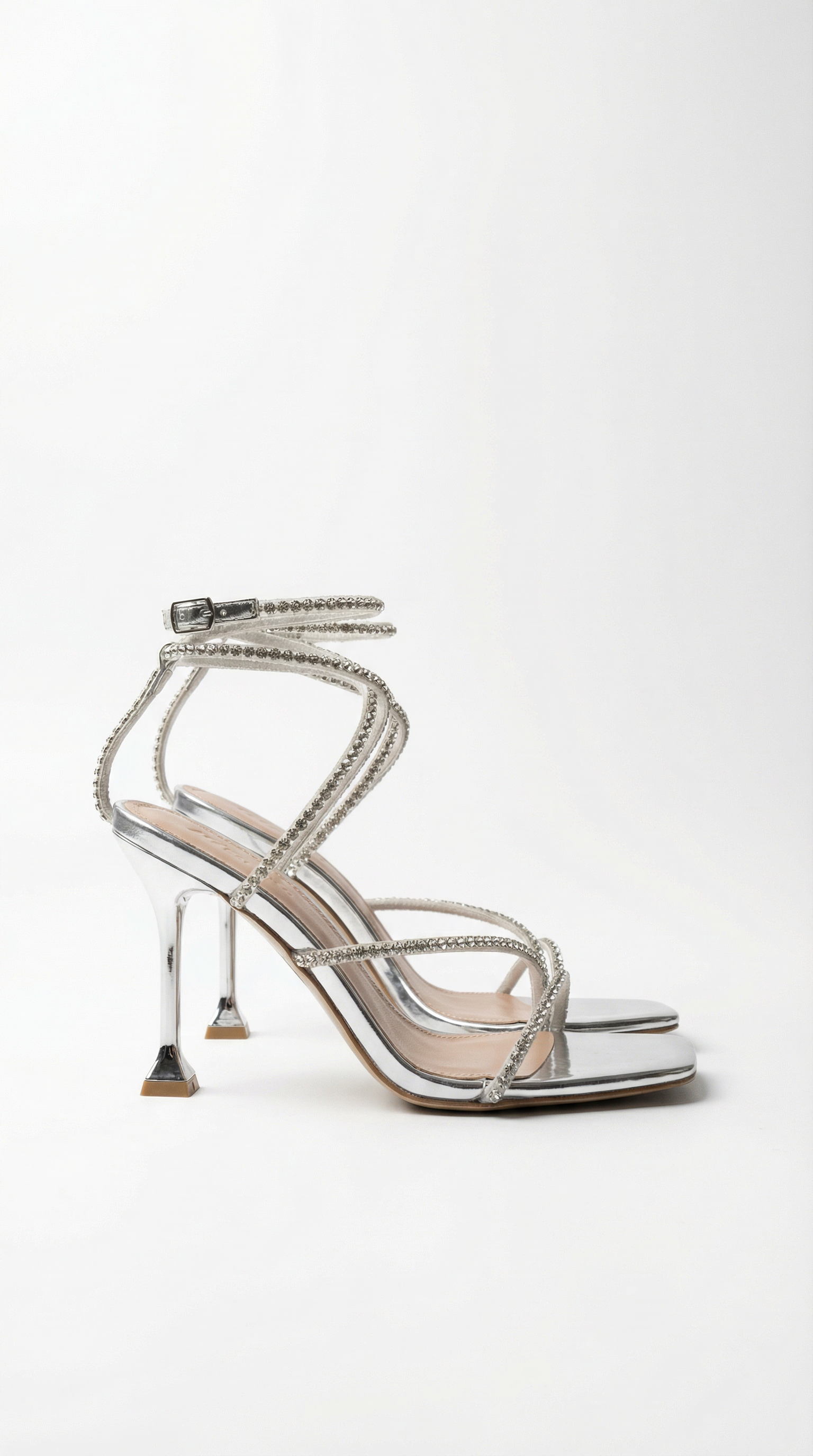 Women silver heeled sandals with wrap straps and rhinestone detail