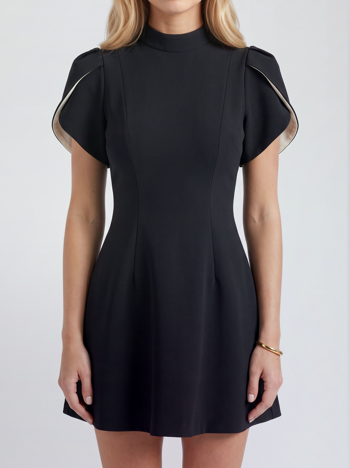 Women black mini dress, close view of the petal cap sleeves